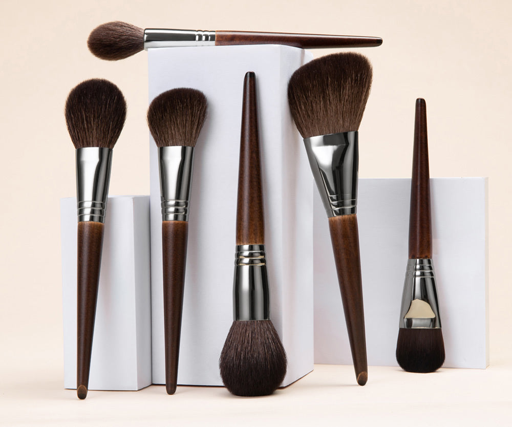 Woman with Handcrafted Wood Handle Brushes – pro wool brushes for beauty