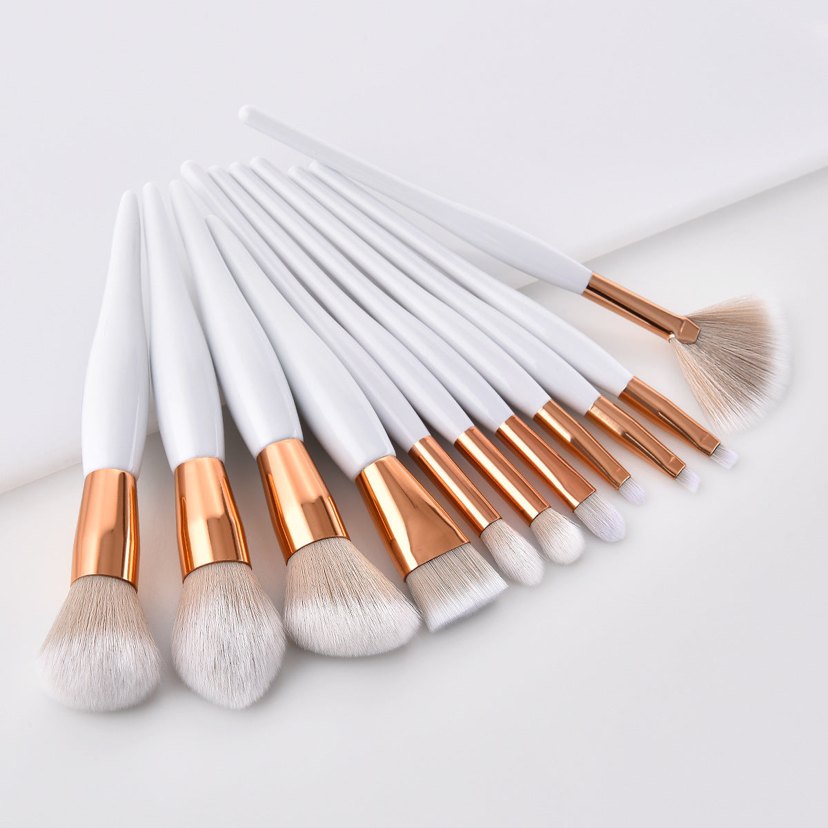 11-piece What Makeup Brush set with high-gloss wooden handles and gold mouth tubes