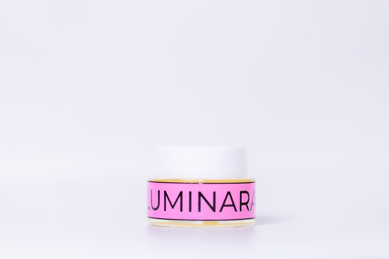 Pink and gold container with 'Luminara' branding on a white background
